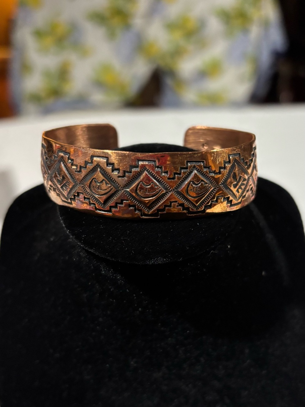 Navajo handcrafted copper bracelet stamped with artisans logo